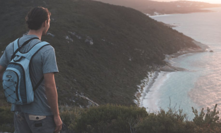 Solo Traveler Enjoying Sunset on a Remote Beach